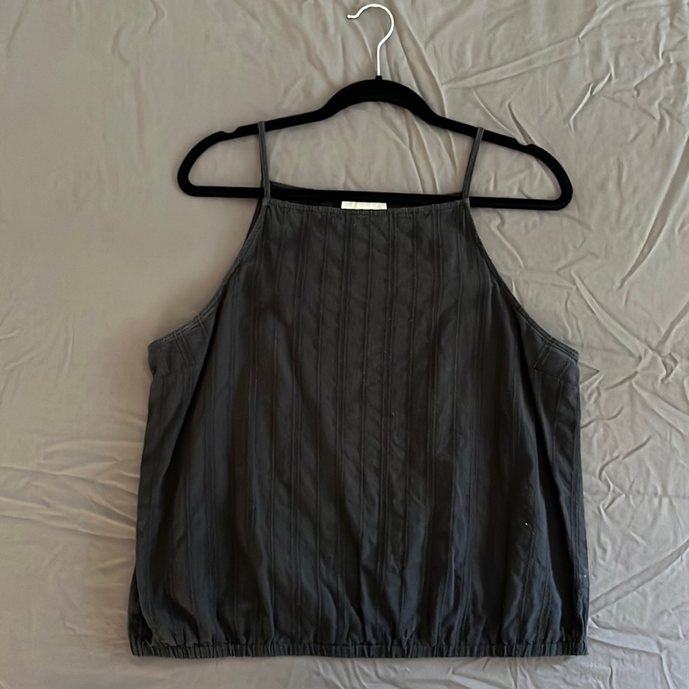 High neck black tank with texture detail and cinched bottom